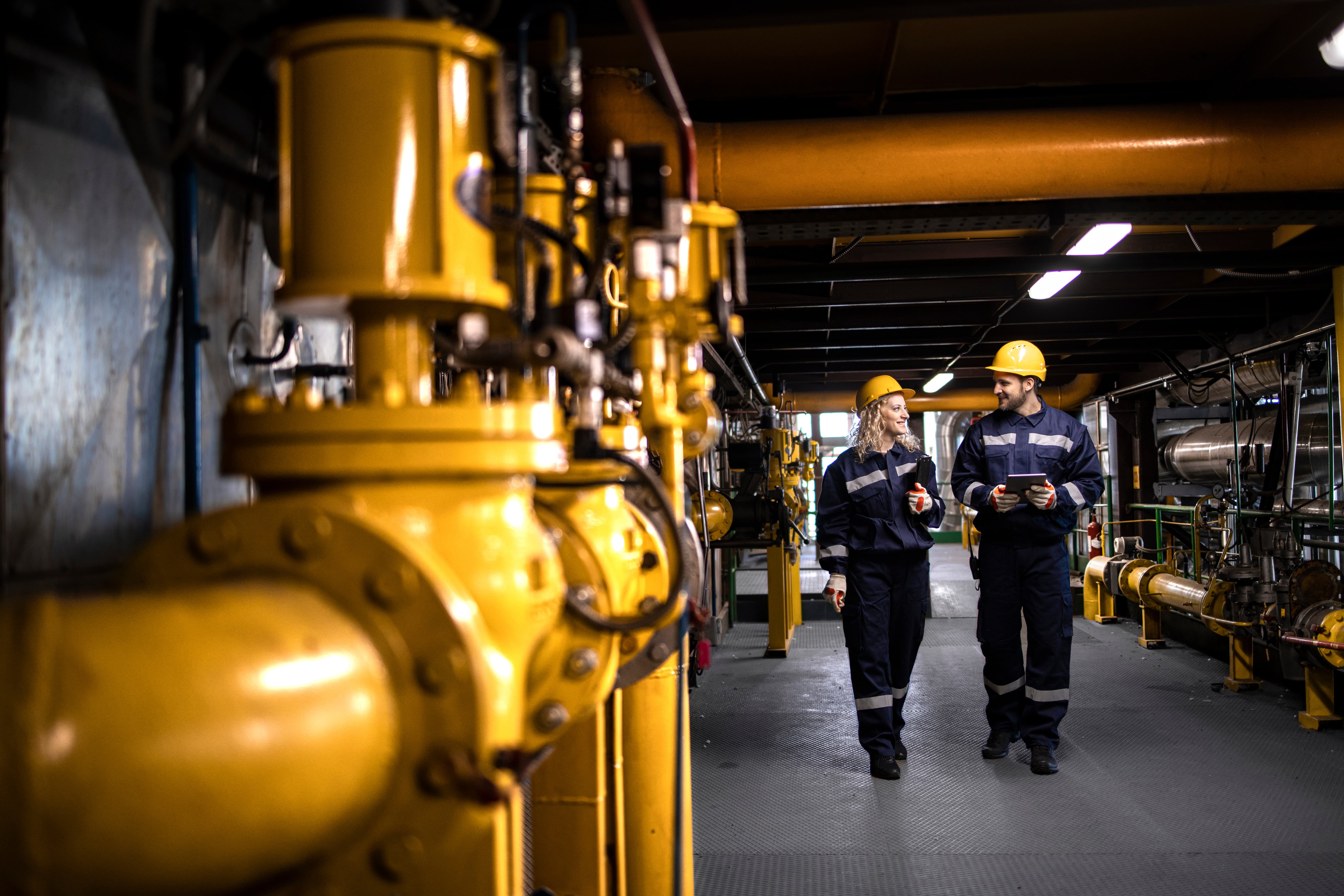 two machinery workers