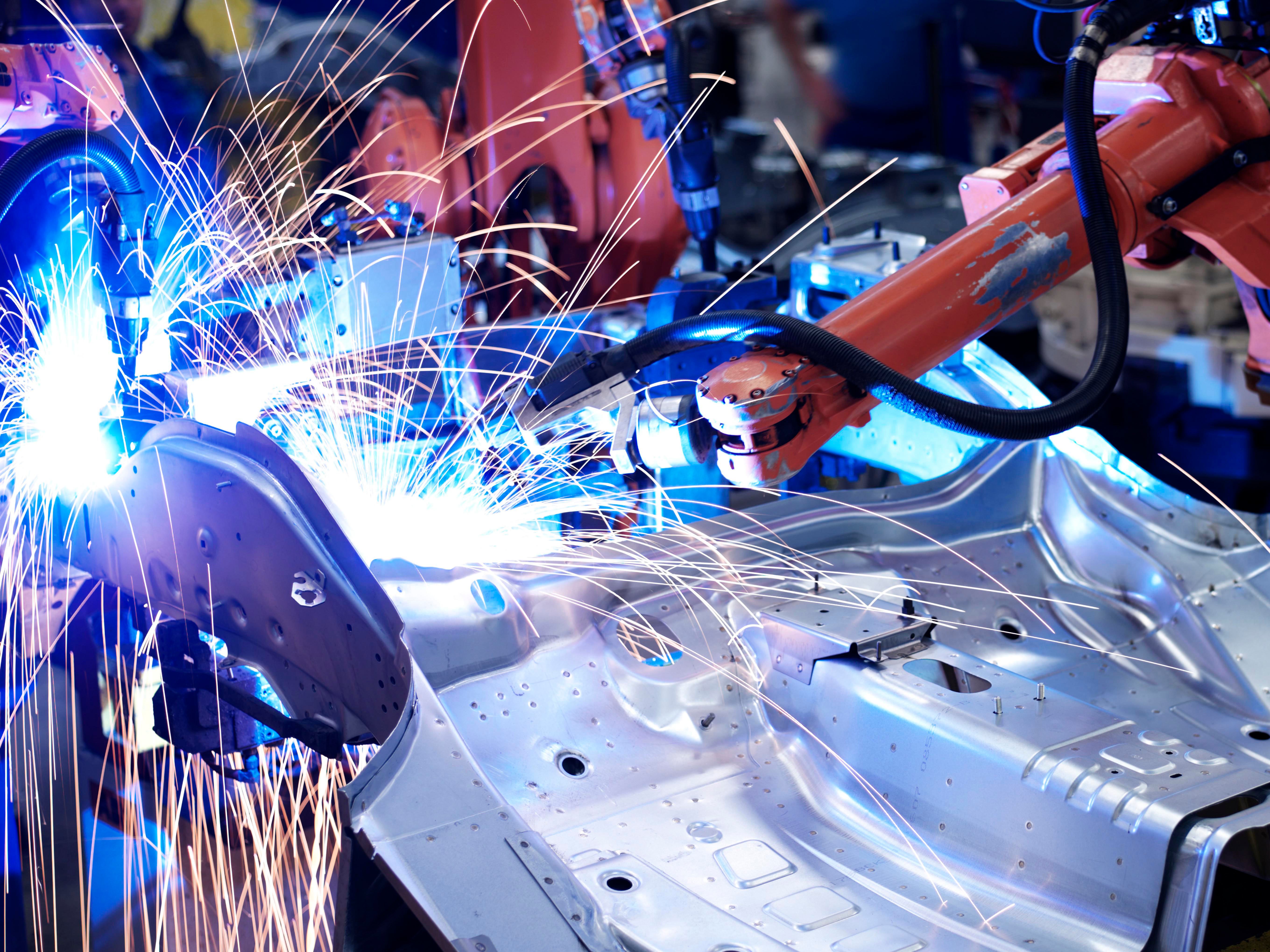 Robots manufacturing in car factory