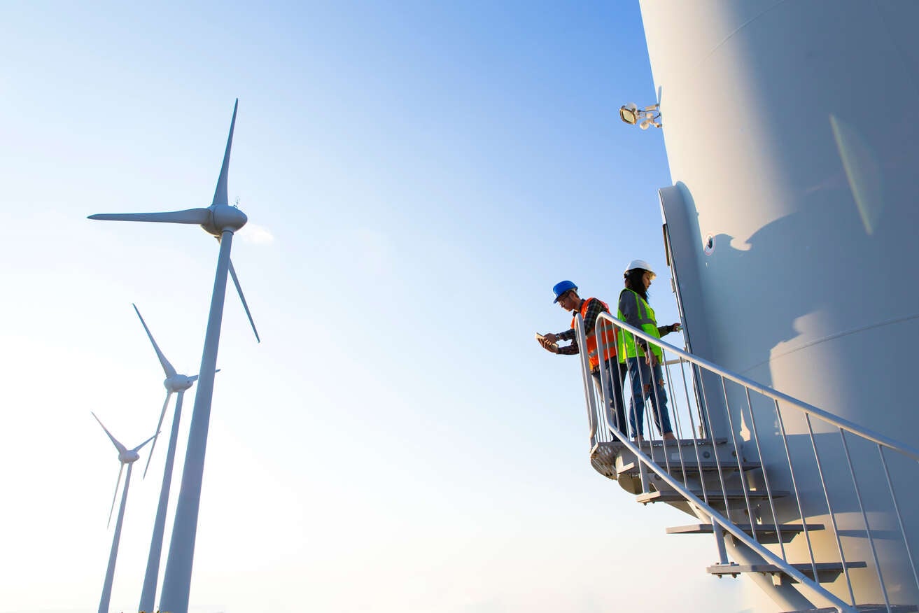 Maintenance engineers working on wind turbine