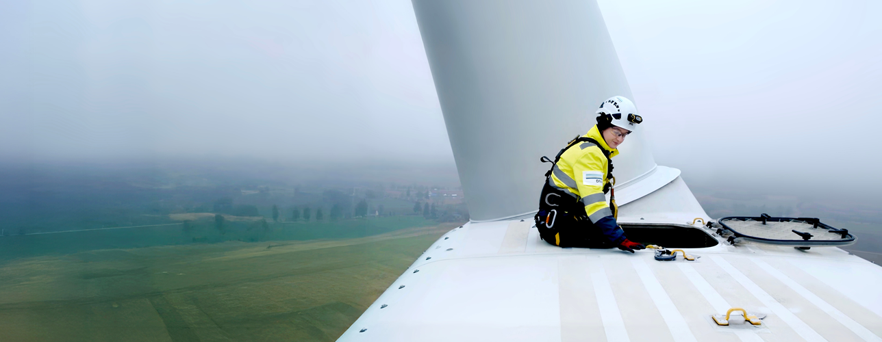 DNV worker sitting on a windmill 