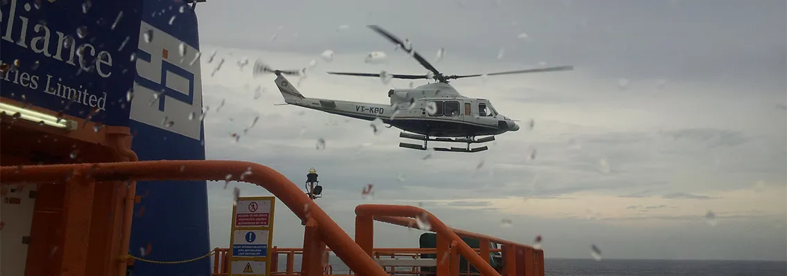 Helicopter landing on location offshore in stormy weather
